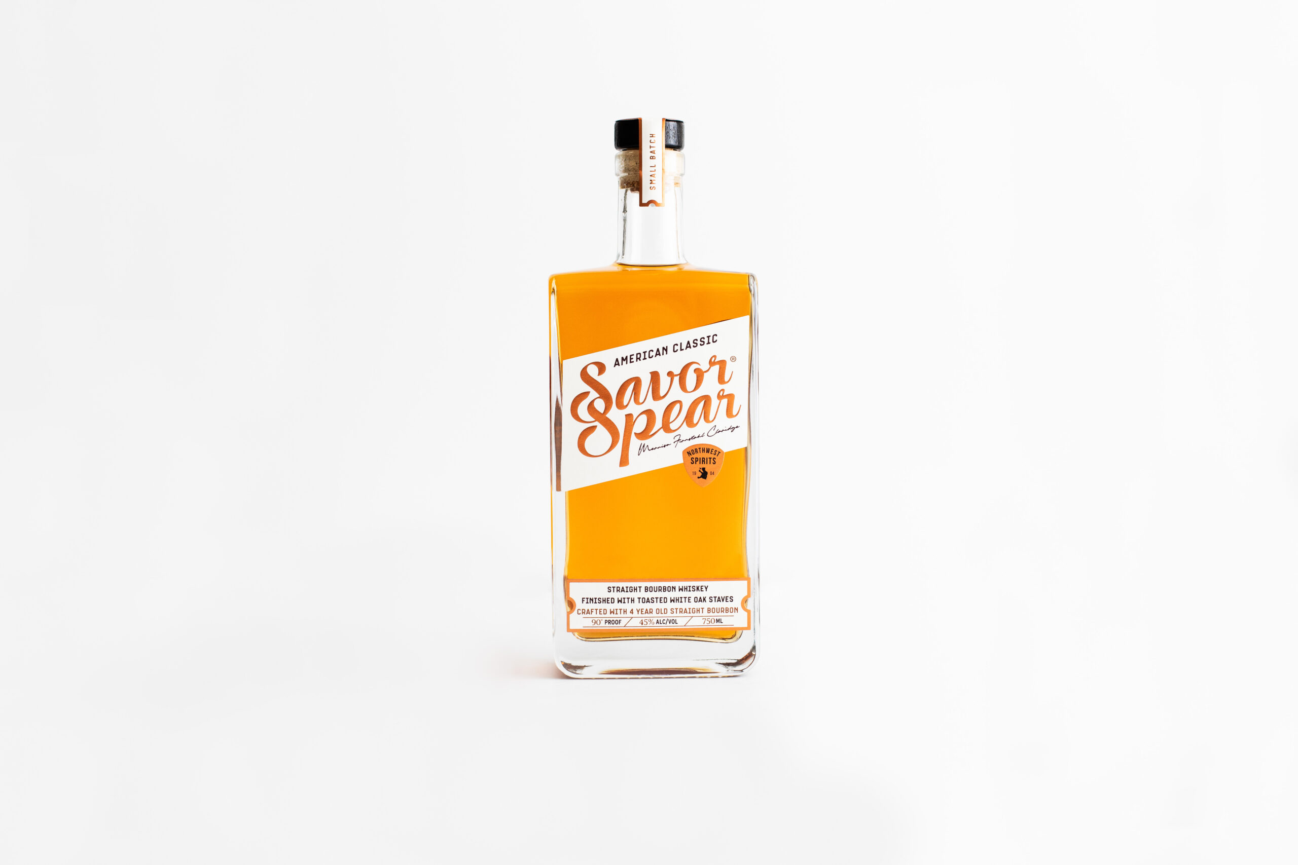 A bottle of Savor Spear Classic American Bourbon sits on a clean white backdrop