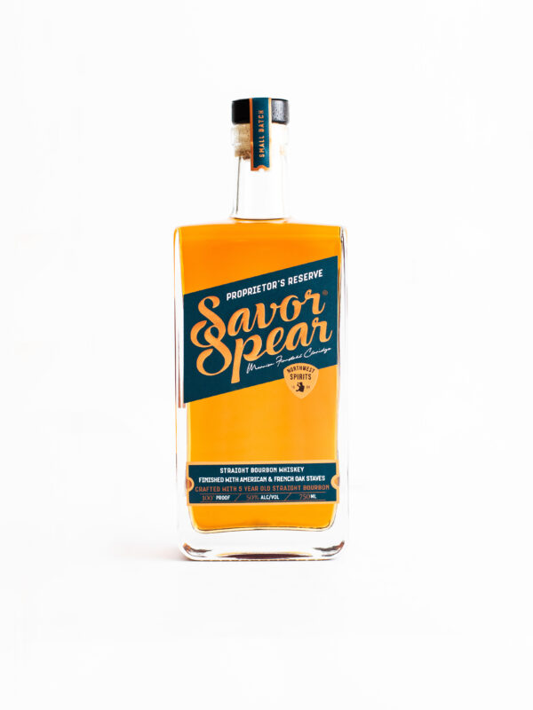 A bottle of Savor Spear Classic Proprietor's Reserve Bourbon sits on a clean white backdrop
