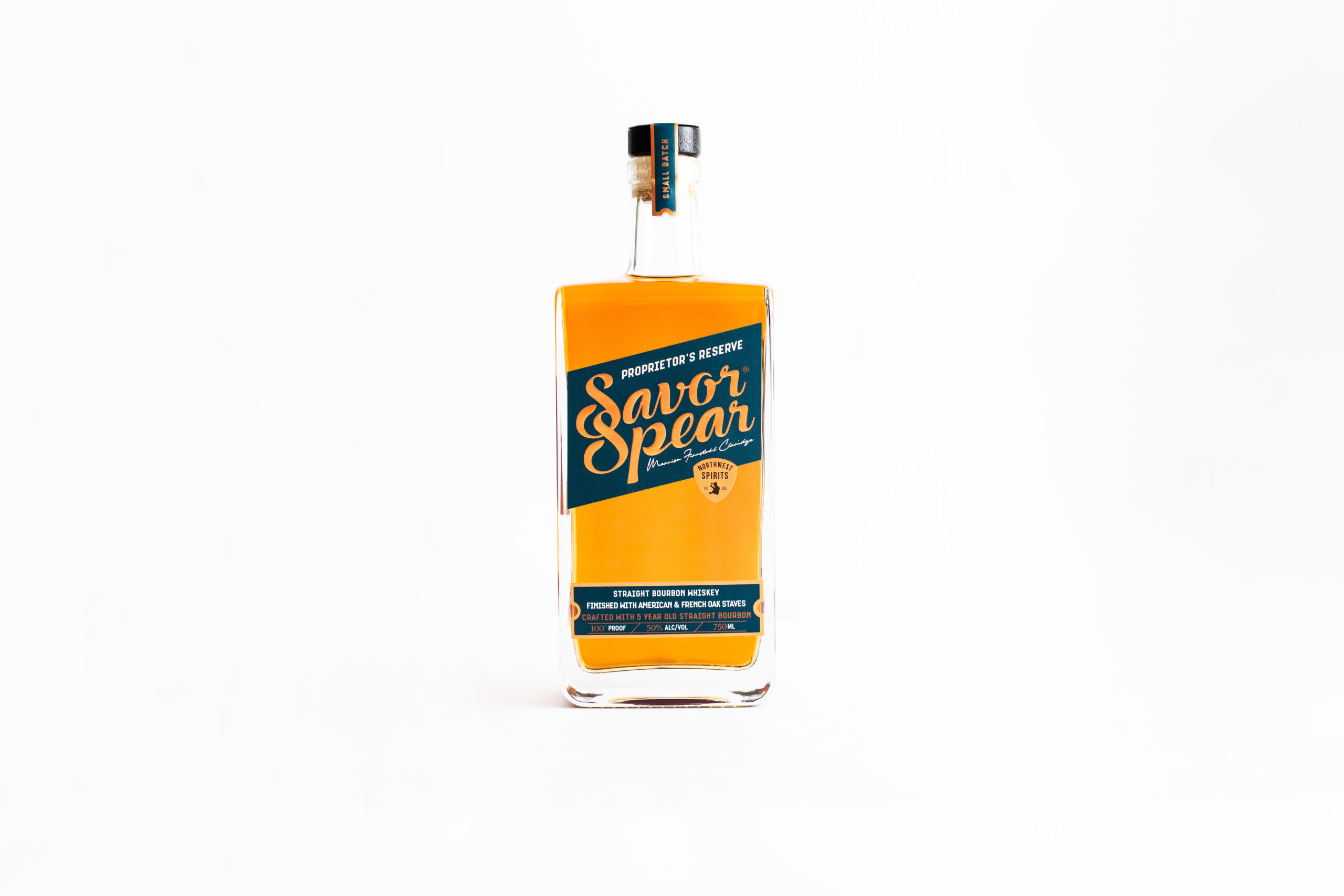 A bottle of Savor Spear Classic Proprietor's Reserve Bourbon sits on a clean white backdrop