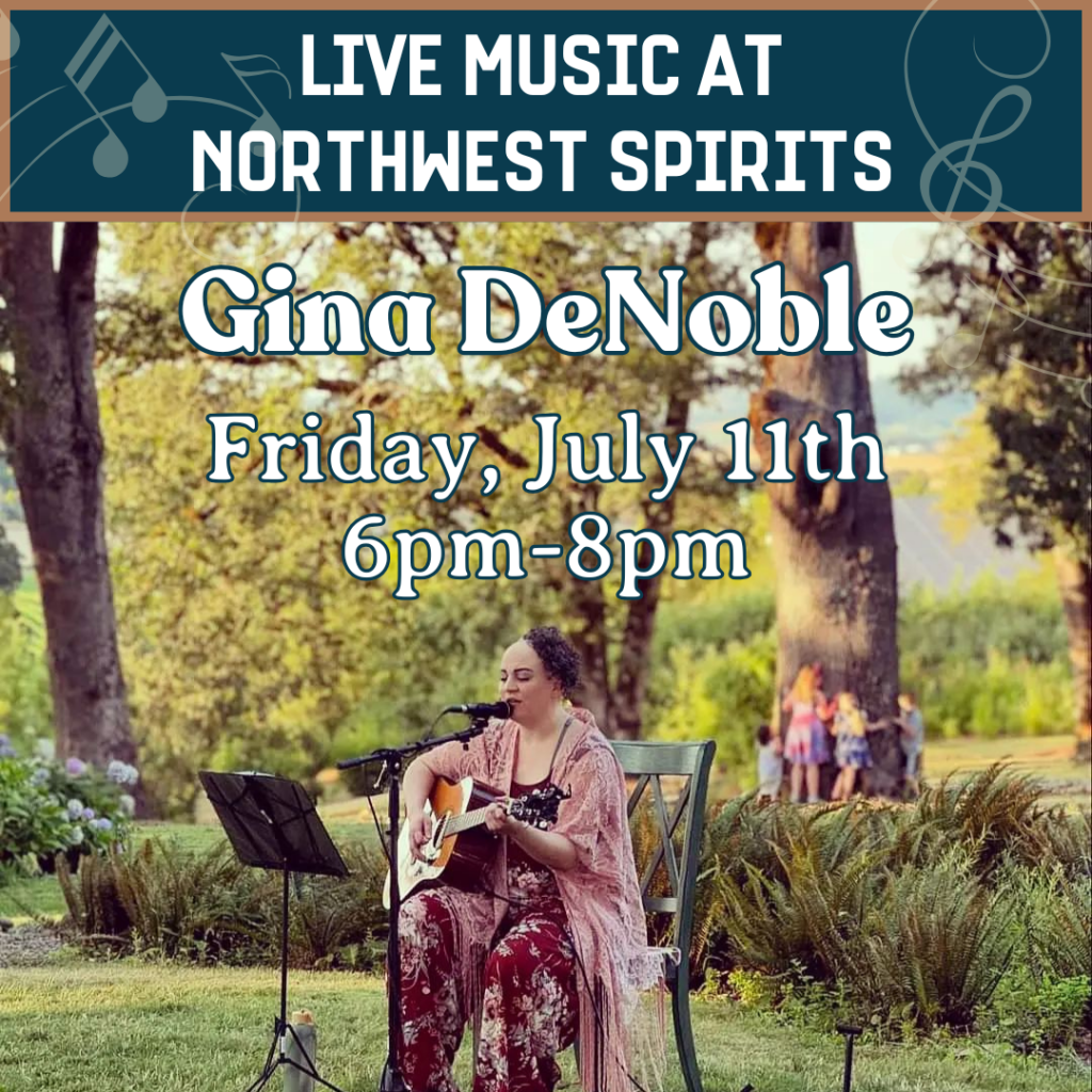 Promotional image for live music at Northwest Spirits featuring Gina DeNoble. Gina is seated outdoors in a scenic garden setting, playing acoustic guitar and singing into a microphone. She wears a floral outfit and sings beside a music stand under large trees. Text on the image reads: "Live Music at Northwest Spirits. Gina DeNoble. Friday, July 11th, 6pm–8pm."